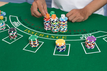 Casino equipment placed on the green floor for risky gambling for the people who want to get rich.