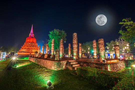 Beautiful scene light color Sukhothai Co Lamplighter Loy Kratong Festival party at The Sukhothai Historical temple park covers the ruins of Sukhothai, in what is now Northern Thailand. With full moon