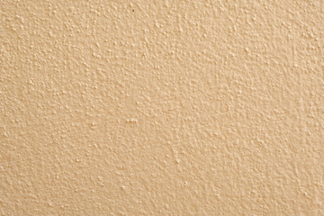 Brown cement wall background close up