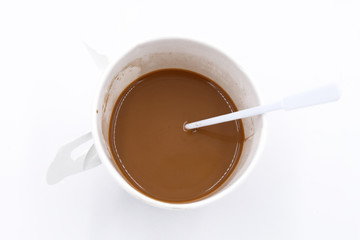 Top view of a paper cup of coffee on white background
