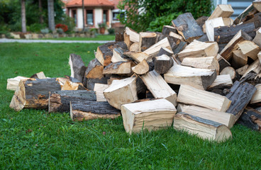 Pile of quartered firewood prepared to heating