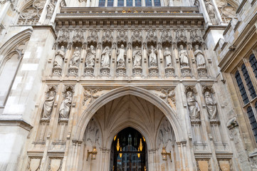 Westminster Abbey's facade with statues, London, UK.