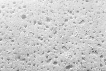 The texture of expanded polystyrene closeup. Sound and thermal insulation for construction, production of containers and lodges.