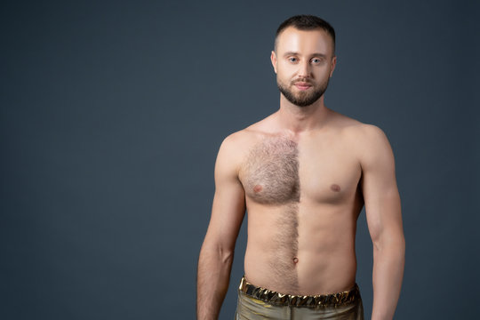 Hairy male chest shaved on one half. Unshaven man's body. The man shaves his belly and breasts.