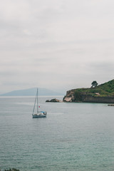 Vocation in Greece, Corfu. Water, cliff, mountains, and beautiful summer evening 