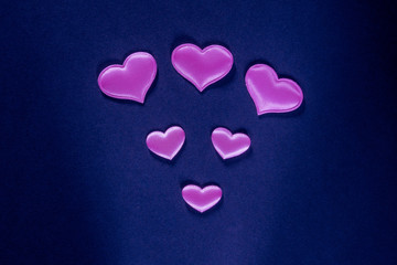 Decorative design for Valentine's Day. Hearts on a blue background.