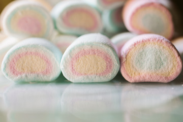 Colorful marshmallows as background. Close up of fluffy marshmallows with copy space. 