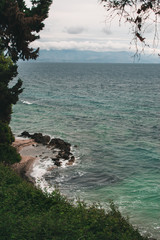 Vocation in Greece, Corfu. Water, cliff, mountains, and beautiful summer evening 