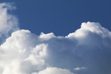 puffy clouds blue sky