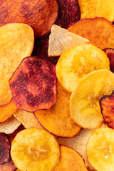 A close-up of dry fruit and vegetable chips, healthy vegan snack, a tasty mix