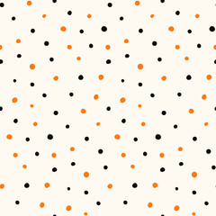 Halloween hand drawn seamless vector pattern with orange and black polka dots on a white background. Flat style design. Concept for children textile print, wallpaper, wrapping paper, holiday decor.