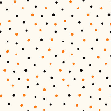 Halloween hand drawn seamless vector pattern with orange and black polka dots on a white background. Flat style design. Concept for children textile print, wallpaper, wrapping paper, holiday decor.