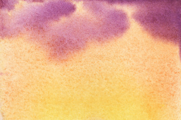 Abstract hand drawn spotty background. Element of tender sunset yellow sky with blurred purple splashes of fluffy clouds. Watercolor brush stroke illustration with grained paper texture