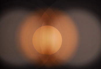 Golden Ball Sun. Abstraction. The background is black