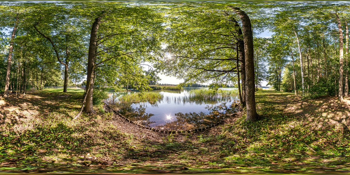 full seamless spherical hdri panorama 360 degrees angle view on pedestrian walking path among the bushes of forest near river or lake in equirectangular projection, ready VR AR virtual reality content