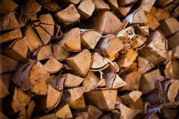 Woodpile of firewood. Birch firewood for the stove. Firewood for the winter.
