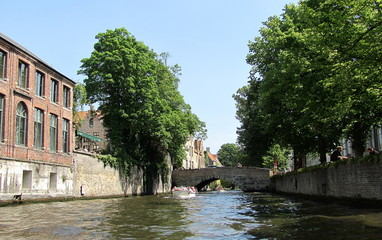 Fototapeta na wymiar Scenery with water canal in Bruges, Belgium