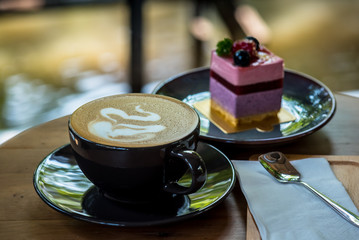 Breakfast with coffee and blueberry cheesecake on the garden terrace