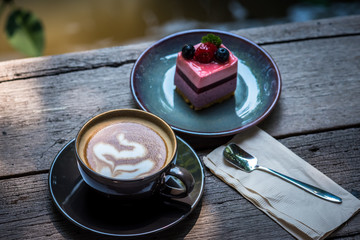 Breakfast with coffee and blueberry cheesecake on the garden terrace