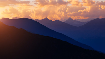 A look at the grand ridge at twilight. Location Upper Svaneti, Georgia country, Europe. Main Caucasian ridge.