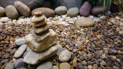 Fototapeta na wymiar Zen stone on​ garden floor 
