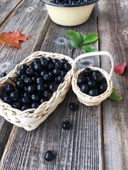 Fresh chokeberry on a wooden table view