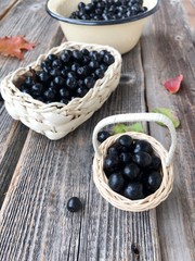Fresh chokeberry on a wooden table view