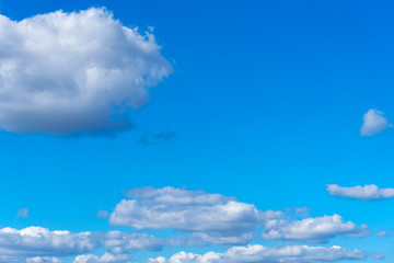 Obraz na płótnie Canvas Light cloud in the bright blue sky on a sunny summer day