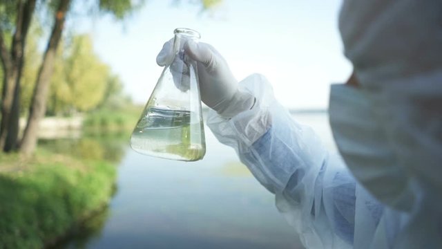 Scientist tests water for infections, harmful emissions