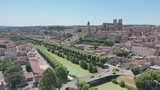 Picturesque summer landscape of French city of Auch on bank of River Gers overlooking Roman Catholic Cathedral and Armagnac Tower