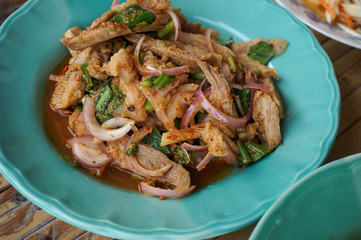 Thai northeast food, Nam-Tok Thai food made from pork and herbs in a green dish