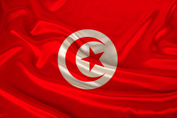 photo of the national flag of Tunisia on a luxurious texture of satin, silk with waves, folds and highlights, close-up, copy space, illustration