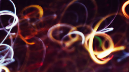 Neon white and yellow lights. Blur glowing swirly lines. Dark abstract art background.