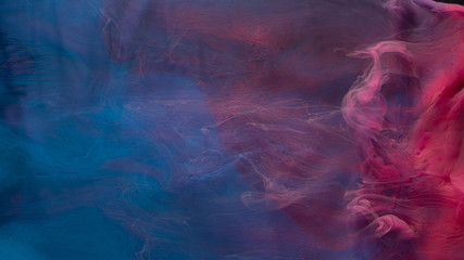 Smoke flow. Magic poison. Blue pink acrylic paint mix. Abstract art background.
