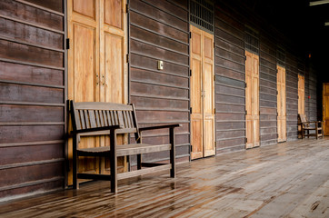 Old wooden bench in the wooden house