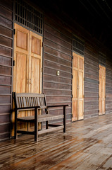 Old wooden bench in the wooden house