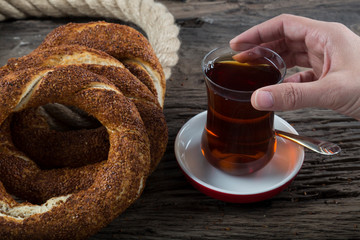 Turkish Simit bagels on the wooden background for breakfast concept.