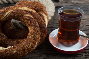 Turkish Simit bagels on the wooden background for breakfast concept.