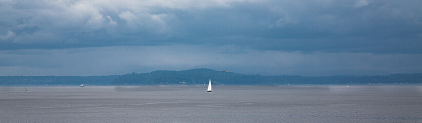White Sail on a Grey Day in Puget Sound