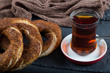 Turkish Simit bagels on the wooden background for breakfast concept.