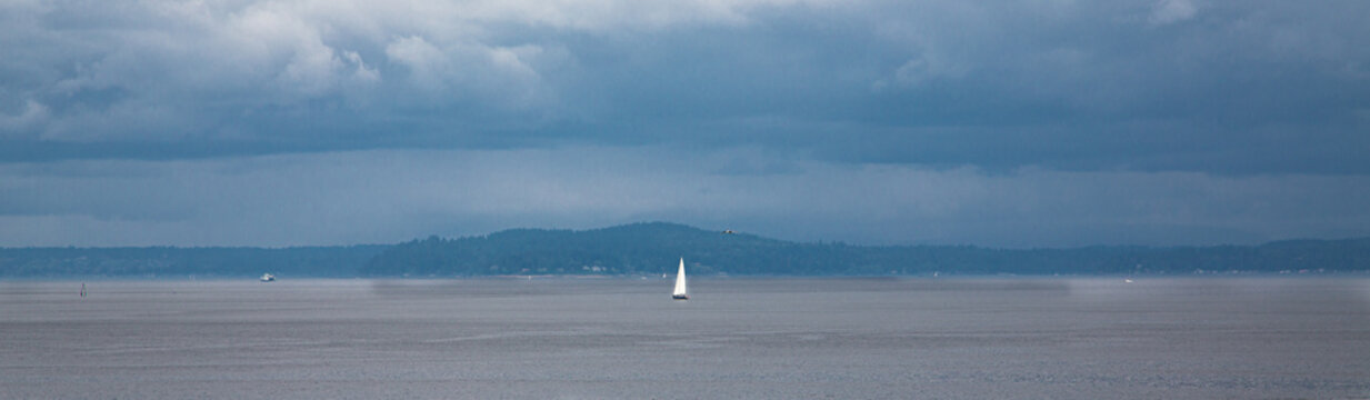 White Sail on a Grey Day in Puget Sound