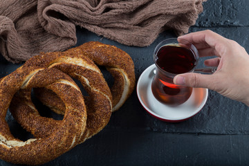 Turkish Simit bagels on the wooden background for breakfast concept.