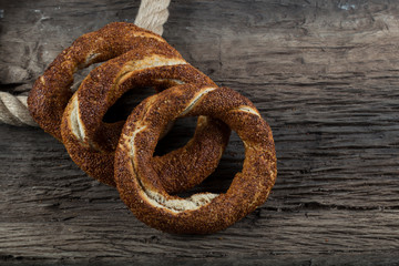Turkish Simit bagels on the wooden background for breakfast concept.