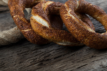 Turkish Simit bagels on the wooden background for breakfast concept.