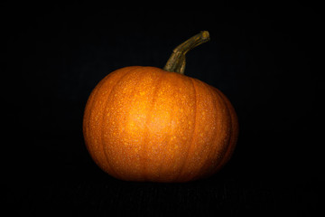 Pumpkin in darkness. Halloween mood. 