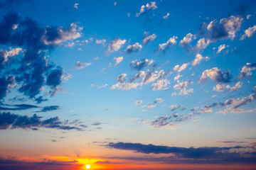 Blue sky with clouds at sunset