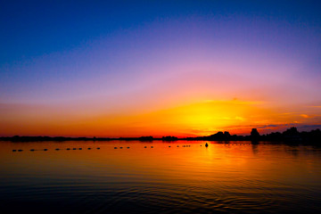 Colorful sky in sunset over the lake
