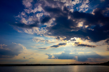 Fototapeta premium Cloudy sunset over the lake