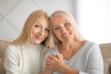 Portrait of beautiful mother and daughter at home