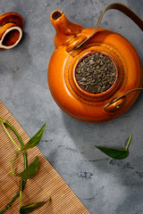 Asian food background - tea on the table. Dark background. Top view.